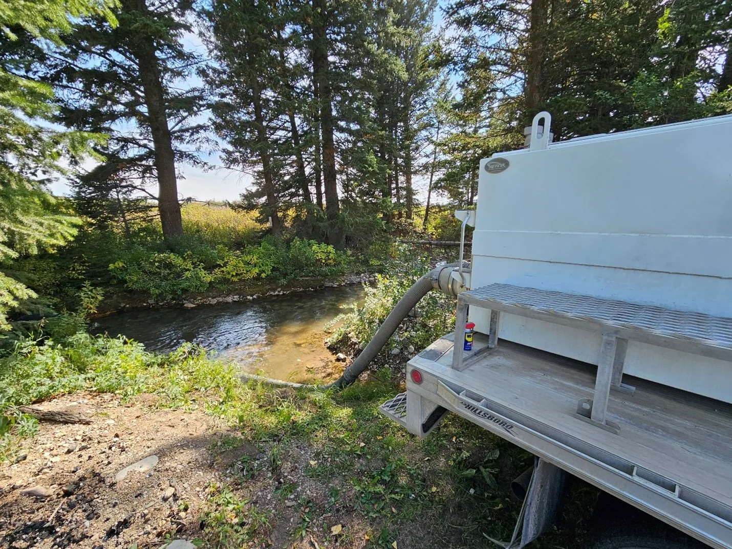 Fish Stocking truck placing fish into a Henrys Lake tributary